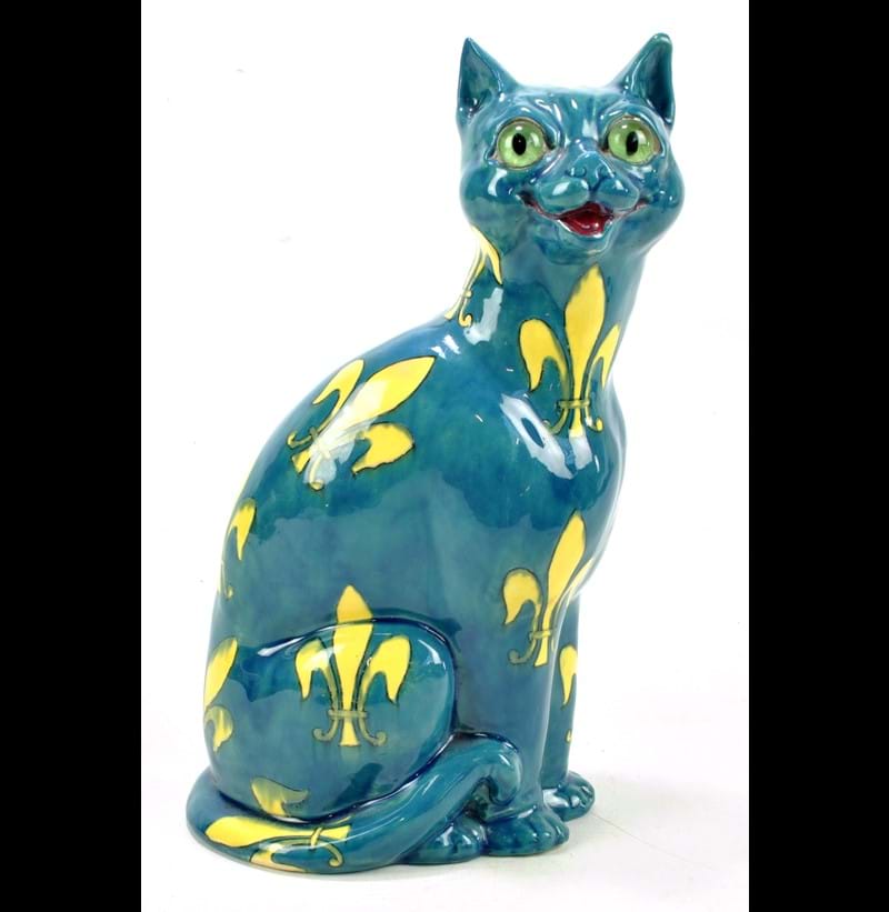 WILEMAN & CO; a rare Foley 'Intarsio' model of a small cat decorated with yellow fleur-de-lis on a blue ground.