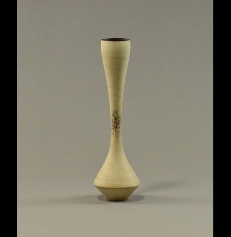HANS COPER (1920-1981); a slender stoneware hourglass vase.
